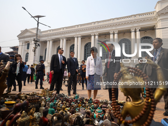 Japanese Foreign Minister Kamikawa Yoko is checking antiques and woodcrafts on display for sale at Kathmandu Durbar Square, a UNESCO World H...