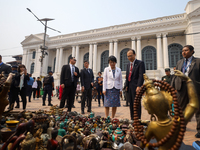 Japanese Foreign Minister Kamikawa Yoko is checking antiques and woodcrafts on display for sale at Kathmandu Durbar Square, a UNESCO World H...