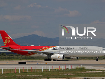 An Airbus A330-343 belonging to Shenzhen Airlines is preparing to take off on the runway at Barcelona-El Prat Airport in Barcelona, Spain, o...