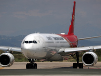An Airbus A330-343 belonging to Shenzhen Airlines is preparing to take off on the runway at Barcelona-El Prat Airport in Barcelona, Spain, o...