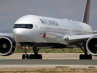An Air Canada Boeing 777-333(ER) is preparing to take off on the runway at Barcelona-El Prat Airport in Barcelona, Spain, on May 1, 2024. (