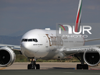 An Emirates Boeing 777-21H(LR) is preparing to take off on the runway at Barcelona-El Prat Airport in Barcelona, Spain, on May 1, 2024. (
