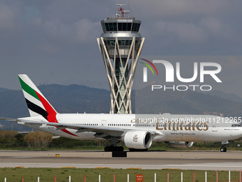 An Emirates Boeing 777-21H(LR) is preparing to take off on the runway at Barcelona-El Prat Airport in Barcelona, Spain, on May 1, 2024. (