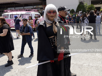 A woman dressed as one of the Star Wars characters is posing at the Reto Fest CDMX convention to celebrate World Star Wars Day at the Churub...