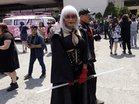 A woman dressed as one of the Star Wars characters is posing at the Reto Fest CDMX convention to celebrate World Star Wars Day at the Churub...