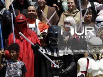 A Star Wars fan is posing as Darth Vader at the Reto Fest CDMX convention to celebrate World Star Wars Day at the Churubusco Convention Cent...