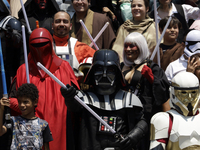 A Star Wars fan is posing as Darth Vader at the Reto Fest CDMX convention to celebrate World Star Wars Day at the Churubusco Convention Cent...