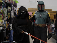 A Star Wars fan is posing as The Mandalorian at the Reto Fest CDMX convention to celebrate World Star Wars Day at the Churubusco Convention...