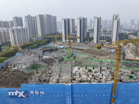 Construction is underway at the Mixc City real estate site in the commercial center of Huai'an City, Jiangsu Province, China, on May 6, 2024...