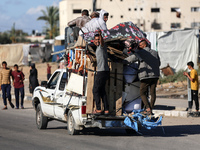 Displaced Palestinians are arriving in Khan Yunis with their belongings after leaving Rafah in the southern Gaza Strip due to an evacuation...
