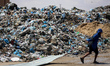 Piles of garbage are accumulating in Khan Yunis, in the southern Gaza Strip, amid the ongo...