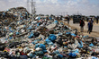 Piles of garbage are accumulating in Khan Yunis, in the southern Gaza Strip, amid the ongo...