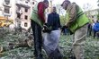 First responders are conducting operations at a damaged site after a Russian attack in Kha...