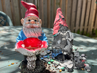 Garden gnomes, including one that is disintegrating due to the weather, are being seen during the spring season in Toronto, Ontario, Canada,...