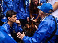 Holocaust survivors talk to young participants attending the 36th anniversary of 'International March of the Living' at the former Nazi-Germ...