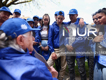 Holocaust survivors talk to young participants attending the 36th anniversary of 'International March of the Living' at the former Nazi-Germ...