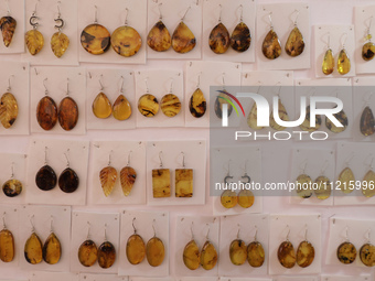 Earrings are being sold at the Apapacho Fair in Mexico City, at the National Museum of Popular Cultures, on the eve of Mother's Day. Product...