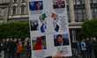 DUBLIN, IRELAND - MAY 6:A protester holds a placard while thousands gathered in Dublin ci...