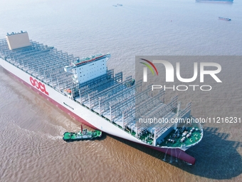 The ''COSCO Kawasaki 397'' super large container ship is leaving the dock for a sea trial in Nantong, Jiangsu province, China, on May 7, 202...