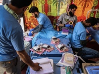 Health care workers are collecting blood from volunteers participating in a blood donation camp organized by the NGO ''Sopore Blood Donors''...