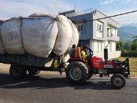 An overloaded tractor is seen in Haldwani, Uttarakhand, India, on April 22, 2024. (