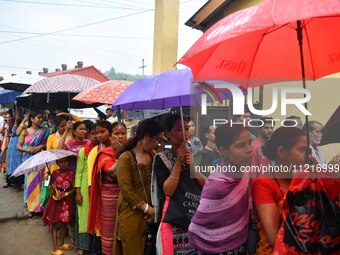 People are queuing to vote at a polling station during the third phase of the general election in Guwahati, India, on May 7, 2024. (