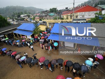 People are queuing to vote at a polling station during the third phase of the general election in Guwahati, India, on May 7, 2024. (
