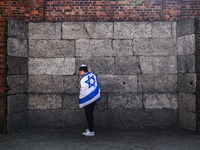 A Jew stands in front of the Death Wall on the 36th anniversary of 'International March of the Living' at the former Nazi-German Auschwitz B...
