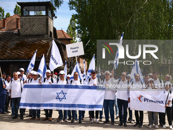 Participants attend the 36th anniversary of 'International March of the Living' marching from the former Nazi-German Auschwitz Birkenau conc...