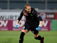 Nemanja Andrijanic, the goalkeeper of Floriana, is reacting in celebration after scoring the decisive penalty kick in the penalty shootout f...