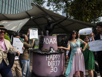Environmental activists from Enter Nusantara, Market Force, and Greenpeace Indonesia, who are part of the Civil Society Coalition, are perfo...