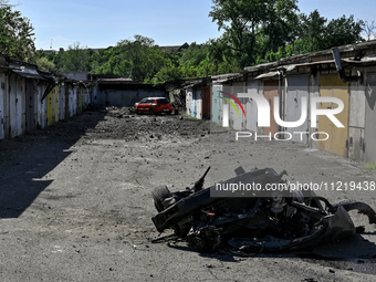 A damaged car is being seen at a garage cooperative after a massive Russian missile and drone attack during the night in Zaporizhzhia, Ukrai...