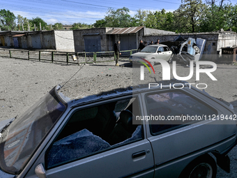 Damaged cars are being seen at a garage cooperative after a massive Russian missile and drone attack during the night in Zaporizhzhia, Ukrai...