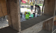 An Indian woman collect drinking water from a supply line on the World Water Day in Dimapu...