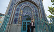 An Iranian voter is leaving a polling station after casting his first electronic ballot in...