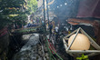 People are dining at an outdoor restaurant in the Darband neighborhood while the second ro...