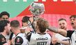 Greg Olley of Gateshead is holding the trophy during the Isuzu FA Trophy Final between Gat...