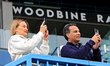 Spectators are taking pictures with their mobile devices at Woodbine Racetrack in Toronto,...