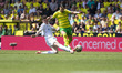 Sam Byram of Leeds United is tackling Borja Sainz of Norwich City during the Sky Bet Champ...
