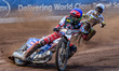Dan Bewley of Belle Vue Aces, in blue, is leading Rohan Tungate of Oxford Spires, in white...