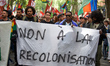 Kanaks are holding a banner reading 'No to the re-colonization'. New Caledonians (Kanaks)...
