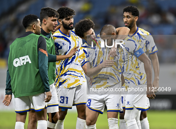 Yacine Brahimi (2-R) of Al-Gharafa SC is celebrating after scoring a goal during the Amir Cup Semi-final match between Qatar SC and Al-Ghara...