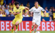 Lucas Vazquez of Real Madrid is competing for the ball with Goncalo Guedes of Villarreal C...