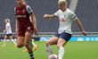 Anouk Denton of West Ham United WFC and Bethany England of Tottenham Hotspur Women are pla...