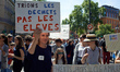 A woman is holding a placard reading 'Let's sort garbage, not pupils'. All education secto...