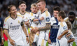Real Madrid players (from L to R) Luka Modric, Federico Valverde, and Antonio Rudiger are...