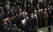 Iranian lawmakers and officials are attending the Parliament hall during an inauguration c...