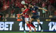 EMAM ASHOUR of Al Ahly is battling for possession with YASSINE MERIAH of Esperance during...