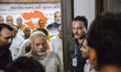 Narendra Modi flashed a triumphant V as he reached his party's office in Gandhinagar