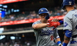 Los Angeles Dodgers' Will Smith #16 is heading back to the dugout after homering during th...